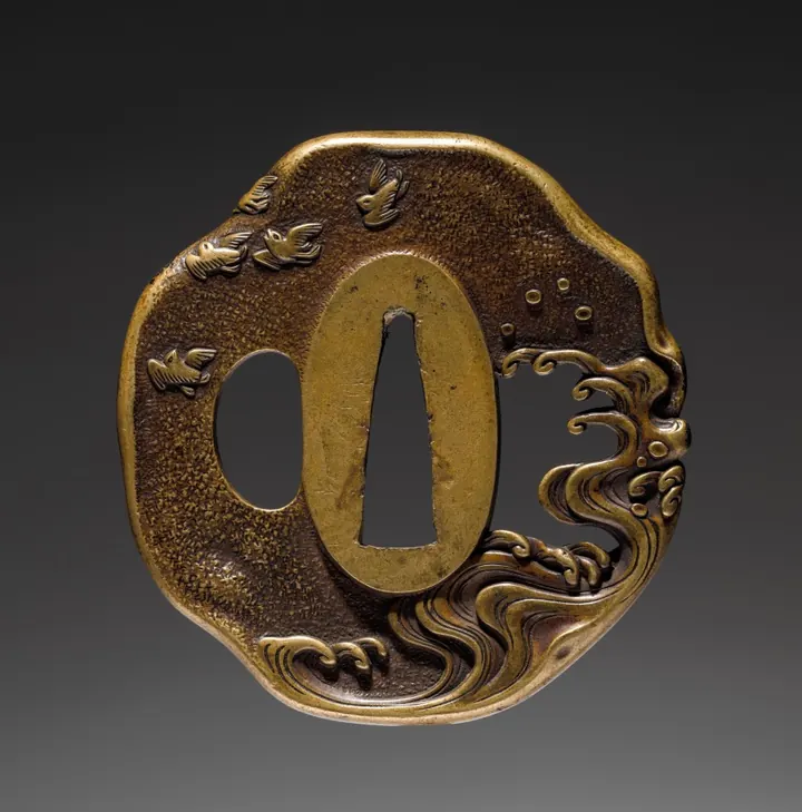 Iron sword guard decorated with birds over waves